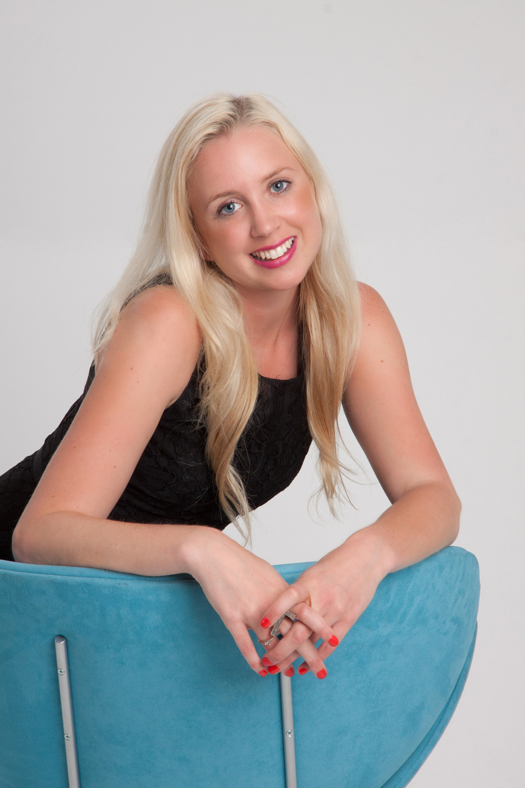 Portrait of young woman posing on a chair