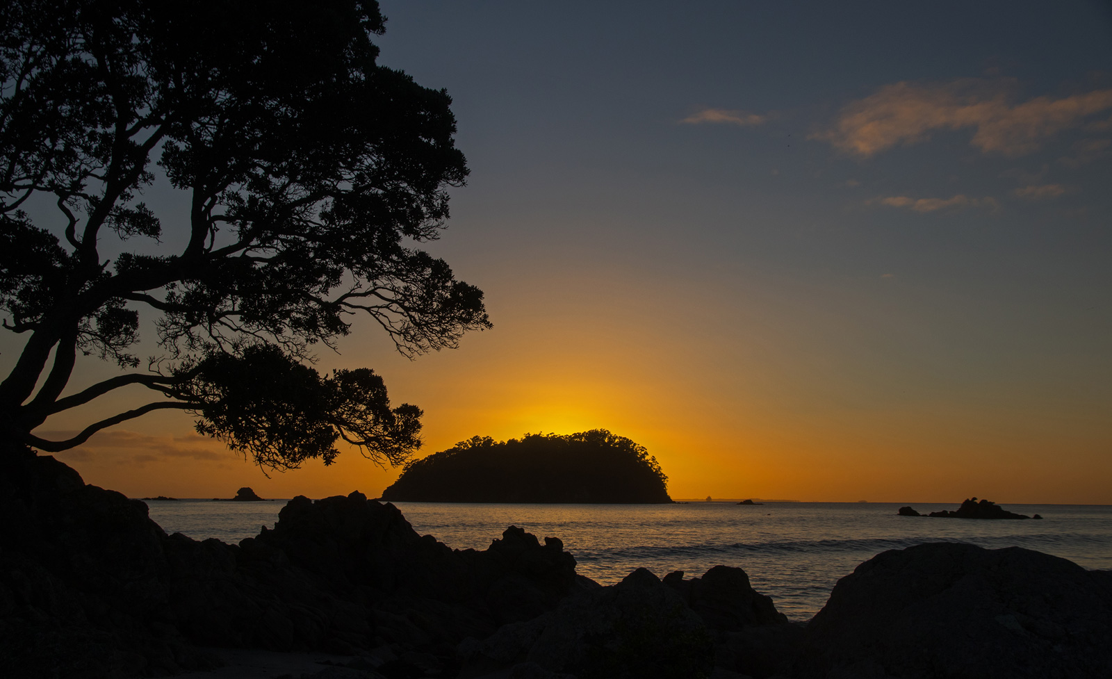 Sunset photo of island out to sea